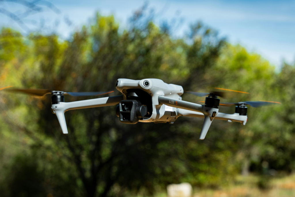 DJI Air 3 drone for real estate aerial photography capturing property and neighborhood views.