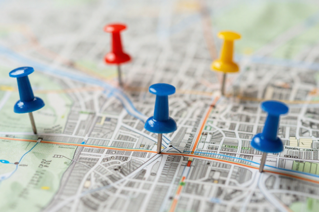 Map with location pins representing targeted cities and neighborhoods for local real estate SEO strategy.