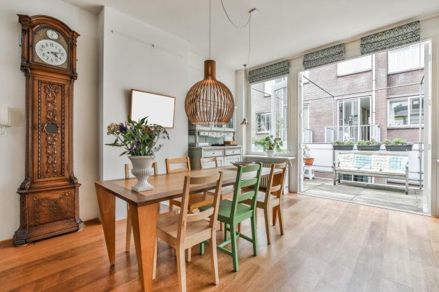 cozy-dining-room-interior-with-wooden-furniture_181624-61067