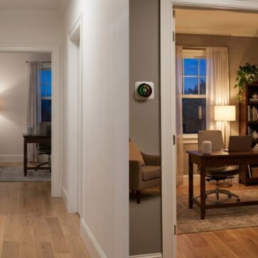 Hallway view showing smart home features transforming an empty office into a staged, tech-ready listing